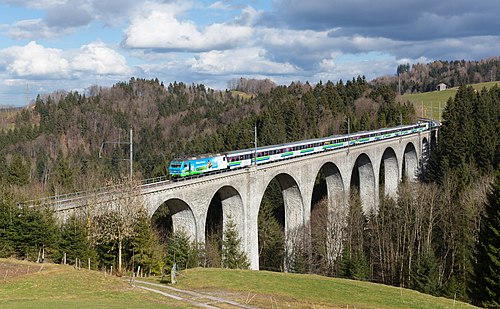 Voralpenexpress cross the Wissbach viaduct near Degersheim