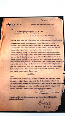 Letter dated 21 April 1945 about the handover of the camp, exhibited at Neuengamme concentration camp. SandbostelLetter.JPG