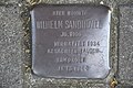 Hier wohnte Wilhelm Sandhövel, Jg. 1900, verhaftet 1934 KZ Sachsenhausen, hingerichtet 11.10.1944