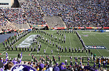 The Northwestern University "Wildcat" Marching Band forms the "Sculpted N" and performs "Go U Northwestern!" to close its pregame performance at the 2005 Sun Bowl under the direction of Daniel J. Farris. Sunbowl-sculptedn.jpg