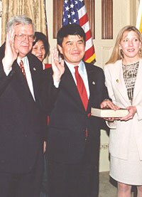 Wu and his wife Michelle as he is ceremonially sworn in by House Speaker Dennis Hastert, January 1999