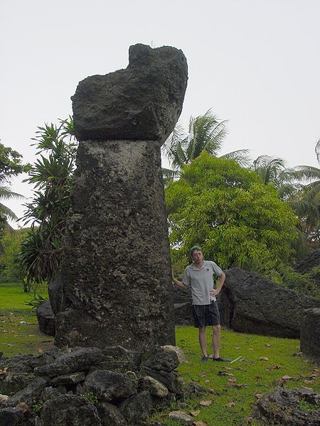 File:Tinian latte stone at Taga House with man.jpg