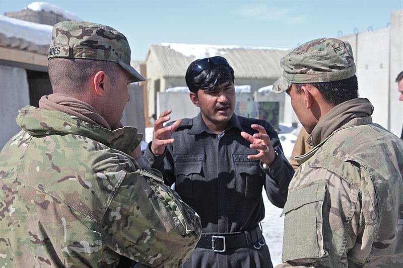 File:U.S. Army Col. Mark Landes, left, the commander of the 3rd Brigade Combat Team, 1st Armored Division, listens as his interpreter translates for a member of the Afghan Uniform Police at Combat Outpost Garda, in 120215-A-BZ540-035.jpg