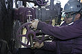 USN sailor operates fuel valve · 070115-N-9479M-004.JPEG