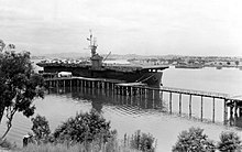Fanshaw Bay moored at Brisbane, Australia, on 10 February 1944, following a transport mission. Note that there are still Republic P-47 Thunderbolt fighters stored on-board her flight deck. USS Fanshaw Bay (CVE-70) moored at Brisbane, Australia, 10 February 1944 (80-G-364211).jpg