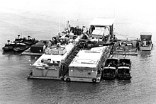 Mobile Riverine Base II with PBRs and UH-1B of HA(L)-3 US Navy Mobile Base II in Vietnam c1968.jpg