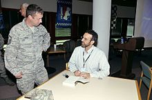 U.S. Air Force Master Sgt. Monty LeBrun, 181st Communications Flight, 181st Intelligence Wing, Indiana Air National Guard, talking with Armin Brott 'The Military Father' 141001-Z-PM441-542.jpg
