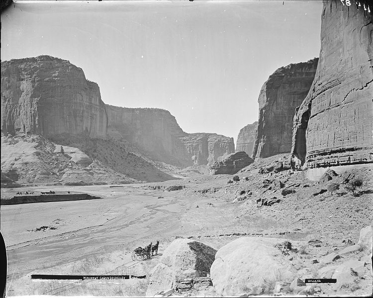 File:(Old No. 114) Monument Canyon De Chelly, Arizona. Hillers photo. A man is standing beside a two-horse wagon in center... - NARA - 517761.jpg