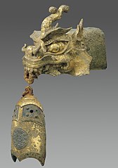 Rafter finial in the shape of a dragon’s head and wind chime