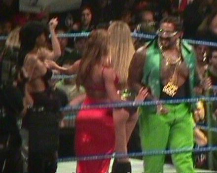 The Godfather alongside his "hoes" at a SmackDown! live show in 1999