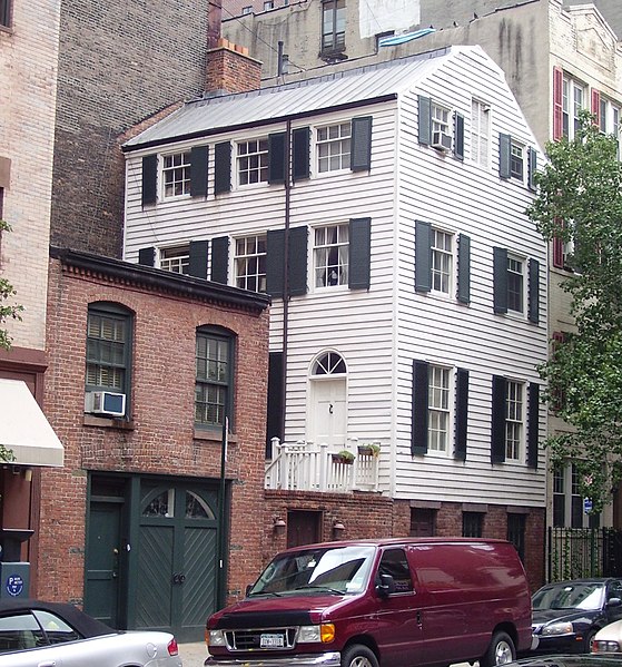 Wood frame house and brick carriage house of uncertain age at 203 East 29th Street