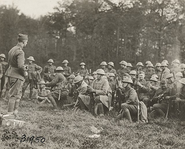 Doughboys of the 2nd Battalion, 318th Infantry, being shown the new phosphorus hand and rifle grenade No.27, Le Neufour, Meuse, France, October 26, 19