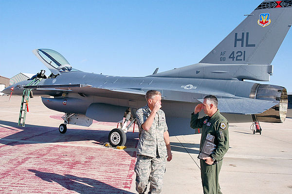 The final 388th Fighter Wing Block 40 F-16 to undergo Common Configuration Implementation Program upgrades is handed over to Col. Scott Dennis (right)