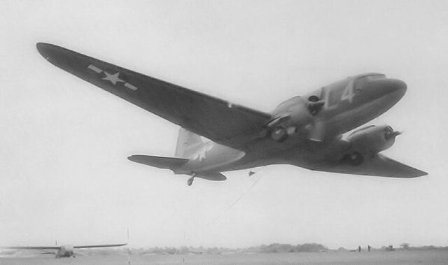 C-47s of the 91st Troop Carrier Squadron practicing the "pick up" method of towing a glider, Upottery, May 1944.