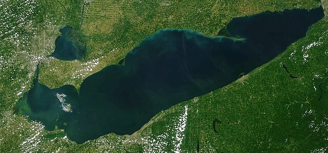 NOAA satellite image of Lake Erie from July 7, 2023. Light green swirls are algae bloom on the western edge of the lake.