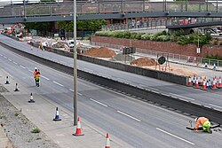 Construction workers seemingly checking drains on the Castle Street section of the A63 during a weekend road closure.