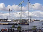 Amsterdam photo of construction cranes 2016, free download; view on the construction sites of the future Pontsteiger and residential area Houthavens. Fons Heijnsbroek, street photography of The Netherlands in high resolution; free image