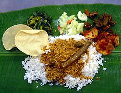 Image 104A typical serve of banana leaf rice. (from Malaysian cuisine)