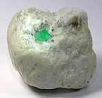 Emerald crystal (about 1 cm) in calcite matrix, Muzo, Colombia