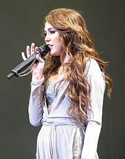 Cyrus performing "Bottom of the Ocean" on the concert tour Bottom of the Ocean Wonder World Performance-edit.jpg