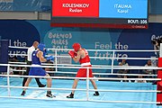 Deutsch: Boxen bei den Olympischen Jugendspielen 2018 Tag 12, 18. Oktober 2018 - Kampf um Bronze im Leichten Schwergewicht Jungen – Karol Itauma (Großbritannien, blau) schlägt Ruslan Kolesnikov (Russland, rot) 4-1; Ringrichter ist Alejandro Barrientos (Kuba). English: Boxing at the 2018 Summer Youth Olympics on 18 October 2018 – Gold Medail Match light heavyweight Boys - Karol Itauma (Great Britain, blue) beats Ruslan Kolesnikov (Russia, red) 4-1; Referee is Alejandro Barrientos (Cuba). Español: Boxeo en los Juegos Olímpicos Juveniles de Verano de 2018 en 18 de octubre de 2018 - Medalla de oro de los hombres de peso pesado ligero: Karol Itauma (Gran Bretaña, azul) vence a Ruslan Kolesnikov (Rusia, rojo) 4-1; El árbitro es Alejandro Barrientos (Cuba).