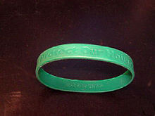 Countrywide Financial Corporation's loyalty bracelet bearing the slogan "Protect Our House". In 2007, employees were issued the wristbands upon signing a loyalty oath. According to a senior CFC officer, the consequence of not getting such a wristband was "I will lose my job." CFC Loyalty Bracelet.JPG