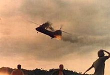 CH-46 from HMM-265 trailing smoke and flame after being hit by PAVN anti-aircraft artillery. The helicopter crashed and exploded upon impact, killing 13 Marines CH-46 Shot down during Operation Hastings.jpg