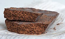 A block of unrefined ground cocoa paste, comparable to the chocolate that was made before the industrial era, and meant to be grated into drinks. CioccolatoModicano2012-10.jpg