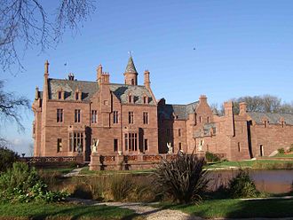 Castle Oliver east facade with ballroom and dining room in main block, servants' wing and coach house on right Co east.jpg