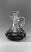 Cruet - a small container for the wine or water to be used in the celebration of the Eucharist