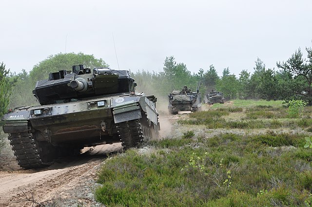 Danish Defence and Lithuanian Armed Forces tanks and armoured personnel carriers conducting battle drills