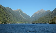 Deep Cove, below Wilmot Pass - the outlet from the Manapouri Hydro Power Station is in the center Deep Cove in Doubtful Sound in front of Wilmot Pass.jpg