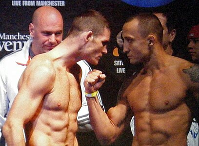 UK's Michael Bisping (left) squaring off against Canada's Denis Kang (right) at the Manchester Evening News Arena.
