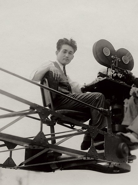 Tsuburaya riding his iron shooting crane in 1934. An adaptation of this crane is still used worldwide today.