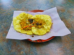 A Trinidadian doubles that consist of two baras filled with curried channa