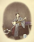 kvinna med shamisen