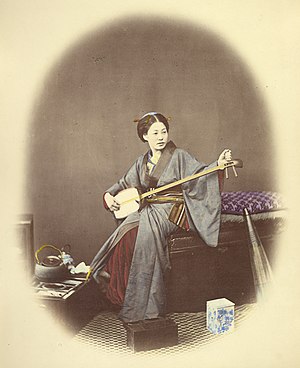 Woman playing a shamisen, 1860s, hand-coloured albumen silver print by Felice Beato Felice Beato Shamisen.jpg