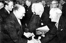 The Federation is honored at the Nobel Peace Prize ceremony in 1963. From left to right: King Olav of Norway, ICRC President Leopold Boissier [de], and League Chairman John MacAulay. Friedensnobelpreis-1963.jpg