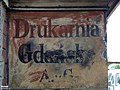 Zachowany szyld z czasów Wolnego Miasta Gdańsk – Drukarnia Gdańska A.G.