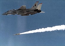 A Grumman F-14 Tomcat fighter aircraft firing an AIM-54 Phoenix air-to-air missile, 1982 Grumman F-14A Tomcat of VF-11 launches AIM-54 Phoenix missile, in 1982 (NNAM.1996.488.256.018).jpg