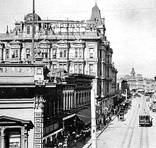 Spring Street, looking north from Temple, 1890s. In the bottom left corner, barely visible is the sign for J. M. Hale Co. at 107-9 (pre-1890: 7-9) Spring St. Hamburger's, the largest retail store in the West, dominates the photo. Hamburger's People's Store Spring Street ca. 1890s.jpg