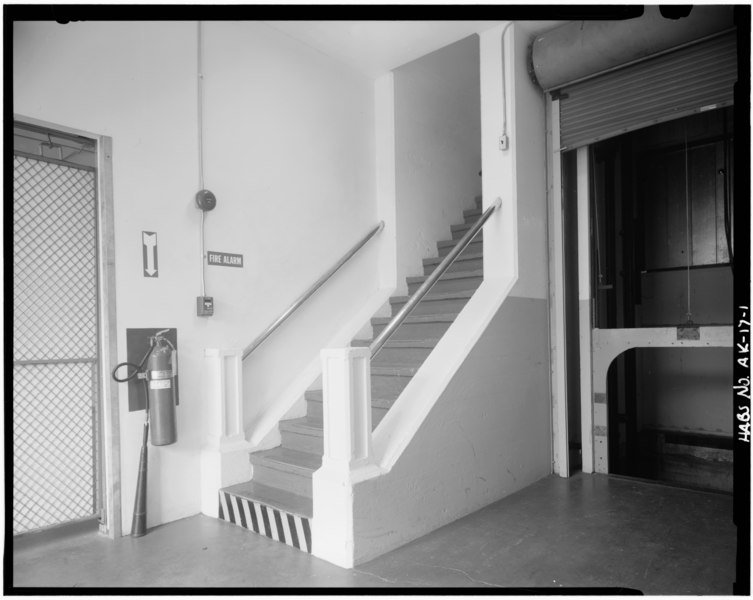 File:INTERIOR VIEW SHOWING THE ORIGINAL STAIRWAY. BOTTOM OF STAIRS FACE THE DOCK AREA. THE ELEVATOR ON THE RIGHT DOES NOT APPEAR TO BE ORIGINAL. - U. S. Coast Guard Headquarters Building, Ketchikan, HABS AK,10-KETCH,1-1.tif