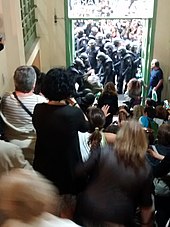 Spanish National Police storm polling station during the 2017 Catalan independence referendum. Intervencio policial a Institut Pau Claris de Barcelona l'1 d'octubre de 2017.jpg