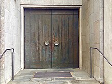  One of two wing front doors of the Catholic parish office of St. Maria in Meckenbeuren made of copper by Erich Stadler