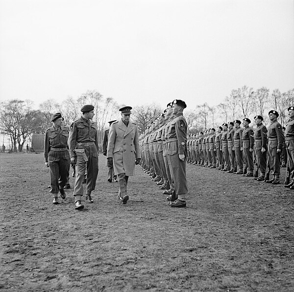 King George VI inspects men of the 7th Battalion, King's Own Scottish Borderers, 1st Airborne Division, in the North Midlands, 1944.