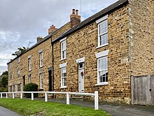 A row of stone houses in the village Kingsthorpe Houses.jpg