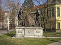 Mining sculpture and Váňa's Stone in a park next to the grammar school in Kladno commemorate coal mining past of the city.