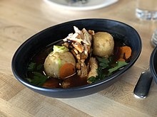 Matzoh ball soup topped with roast chicken Matzo ball soup - Bird and the Bottle - Stierch 2018.jpg