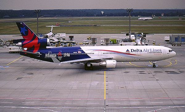 A McDonnell Douglas MD-11 from Delta Air Lines in the 1996 Summer Olympics paint.