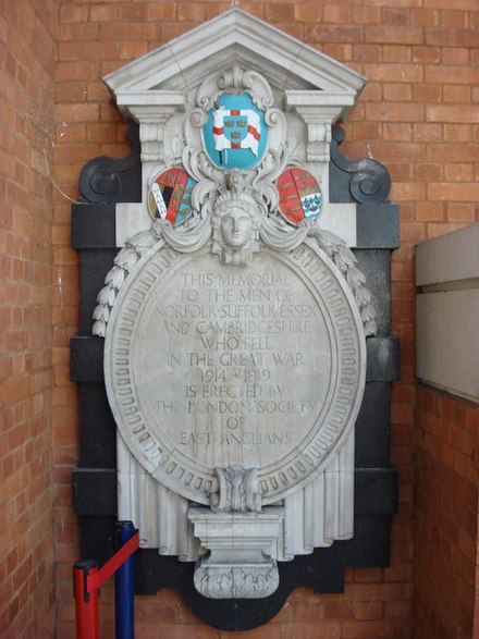 Memorial to East Anglians who died during the First World War in Liverpool Street Station. The memorial, erected by the London Society of East Anglians, displays the flag